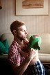 © Cavan for Adobe - Father dressing his baby son (12-17 months)