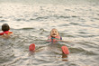 © Cavan for Adobe - Friends swimming in river