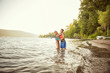 © Cavan for Adobe - Portrait of children wearing life jackets on lakeshore