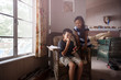 © Cavan for Adobe - Friends (8-9) with smart phone in living room