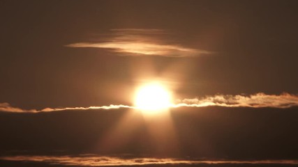 Wall Mural - Glowing Sun Reveal Behind Cloud Layer Time Lapse