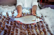 © Cavan for Adobe - Mid-section of fish vendor