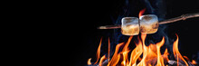 Banner Of Two Marshmallows On A Stick Roasting Over Campfire On Black Background - Camping/Summer Fun Concept