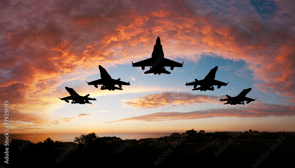fighter flying in the sky at sunset - obrazy, fototapety, plakaty 