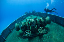 A Diver Explores The USS Kittiwake, One Of The Best-known Wreck Dives In The Caribbean Sea. The 251-foot Long Ship Was Sunk Off The Coast Of Grand Cayman In 2011 In Order To Create An Artificial Reef.
