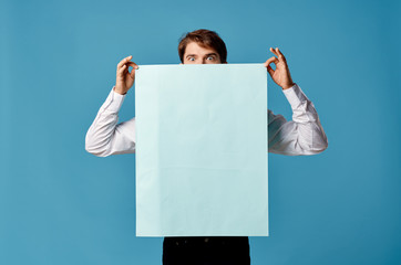 Wall Mural - young man holding white board