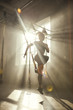 © Friends Stock - Professional training. Full-length of young athletic woman in sports clothing training legs with trx fitness straps in the gym.