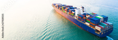 Fotomural Aerial side view container ship carrying container in import export business logistic and transportation of international by container ship in the open sea, with copy space