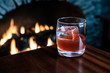 © Michael Marquand - Old fashioned cocktail in front of a fire place