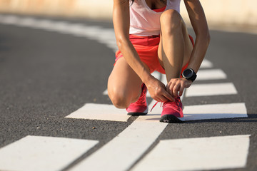 Poster - Healthy lifestyle fitness woman runner tying shoelace