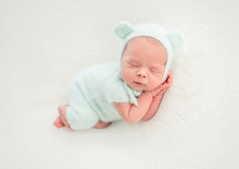 Newborn Baby Sleeping In Mint Clothes