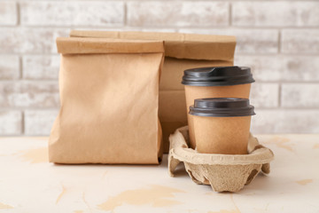 Assortment of food delivery containers on table