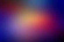 Abstract Blurred Gradient Background In Dark Key. Blue, Violet, Yellow, Red Colors.