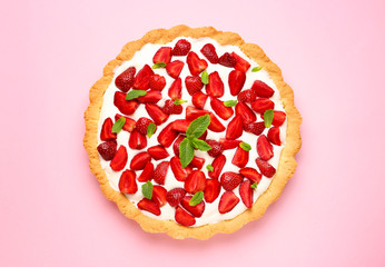 Tasty strawberry cake on color background