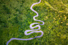 Aerial View Of Cars Driving On Curved, Zigzag Road Or Street On Mountain Hill With Green Natural Forest Trees In Rural Area Of New Taipei City, Taiwan