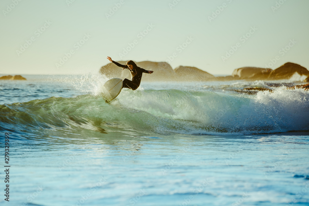 Young man water surfing in the sea - obrazy, fototapety, plakaty 