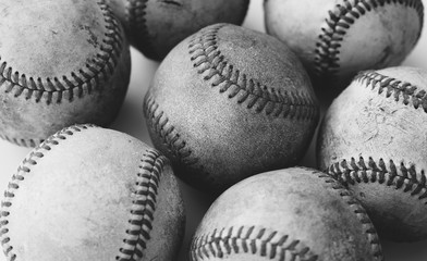 Canvas Print - Group of old baseball balls close up shows detail of vintage leather from use in game.  Sports concept with equipment in black and white.
