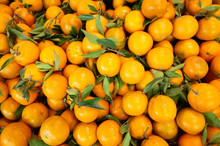 Orange Fruit Stacked On The Marketplace