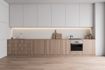 White kitchen interior with wooden countertops