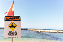 Sign Warning About Strong Current On Beach