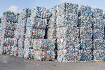 Plastics recycling centers and raw material