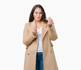 Beautiful plus size young woman wearing winter coat over isolated background Doing money gesture with hand, asking for salary payment, millionaire business