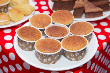 Wall Mural - Top view, flat lay, square . A typical Sicilian street food. Banana cake recipe is a delicious and easy twist on traditional. Holiday cupcakes muffins with plums . Delicious breakfast food concept.