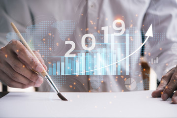 Poster - 2019 New year planning business and financial concept.Man's hand writing on paper with With paintbrush.digital marketing and payment.