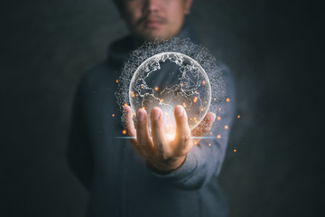 Leinwandbilder - Businessman holding global network and data exchanges over the world.