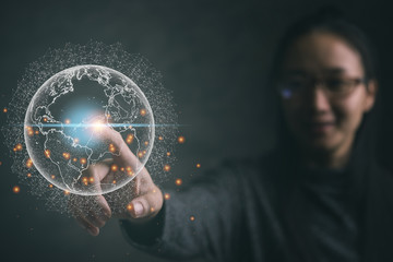 Leinwandbilder - Businesswoman touching global network and data exchanges over the world.