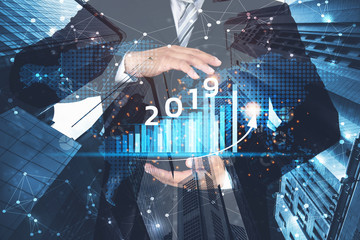 Poster - 2019 New year planning business and financial concept.Man's holding virtual screen with business graph.digital marketing and payment.