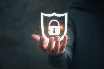 Aufkleber - man holding virtual icon  shield with a lock symbol, concept about security, cybersecurity and protection against dangers