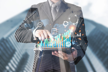 Poster - planning business and financial concept.Man's holding virtual screen with business graph.digital marketing and payment.