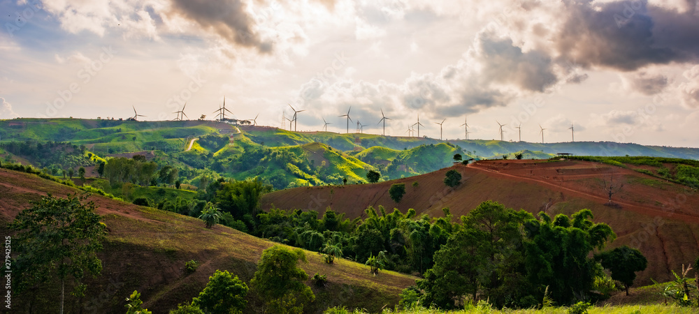 landscape image with Mountain and wind turbine panoramic view. - obrazy, fototapety, plakaty 