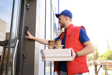 Sticker - Portrait of courier with order at door. Food delivery service