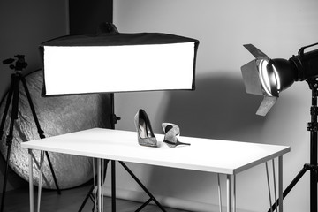 Professional photography equipment prepared for shooting stylish shoes in studio