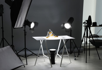 Wall Mural - Professional photography equipment prepared for shooting stylish shoes in studio