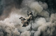 © Meysam Azarneshin - Military soldier with dog roping helicopter between mist and smoke