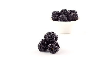 Wall Mural - Blackberries berries on a saucer isolated on a white background.