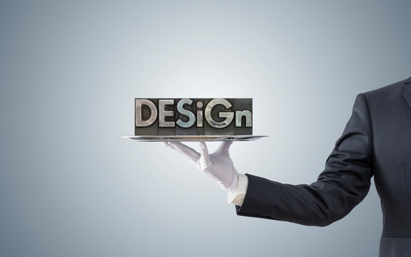 Businessman offering design word on silver tray 