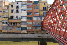 River Houses Landmark In Girona From The Famous Red Bridge, Catalonia