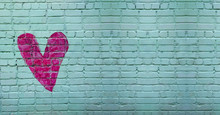 Symbol Of Love Painted On Brick Wall Background