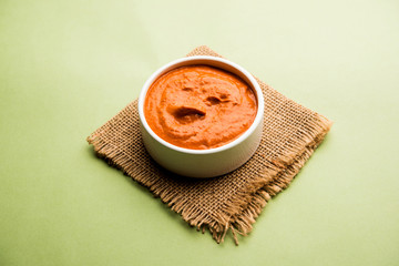 Wall Mural - Peri Peri Sauce in a bowl, originally from portugal, it's a hot sauce made using piri piri or African bird's eye chillies.  selective focus