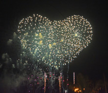 Romantic  Firework  Bursts  In Heart  Shape Against The Night Sky 