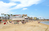 Fototapeta Miasto - Playa La Caleta Beach at Cadiz, Andalusia. Spain.  Unrecognizable Beach Goers and Swimmers.