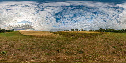 Wall Mural - full seamless spherical hdri panorama 360 degrees angle view among harvested rye and wheat fields with Hay bales in summer day with beautiful cirrocumilus clouds in equirectangular projection