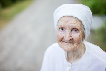 Wall Mural - Smiling senior woman outdoors