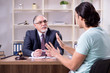 © Elnur - Young man visiting experienced male lawyer
