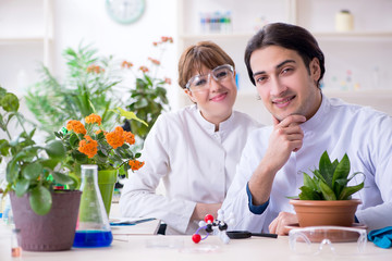 two young botanist working in the lab