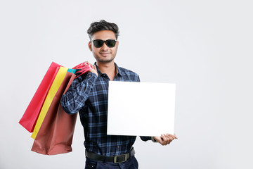 Wall Mural - young indian man with shopping bags, Indian festival